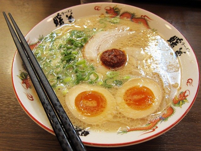 Soup with noodles, egg, and meat.