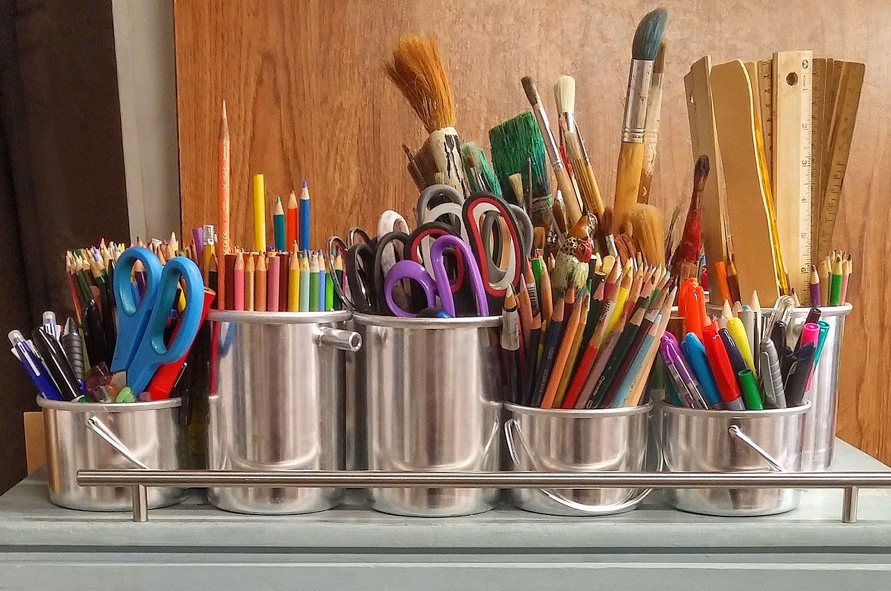 A vibrant display of various art supplies, such as pencils, brushes, and paints.
