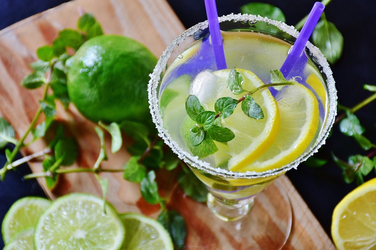 Closeup of lemonade and fresh limes.