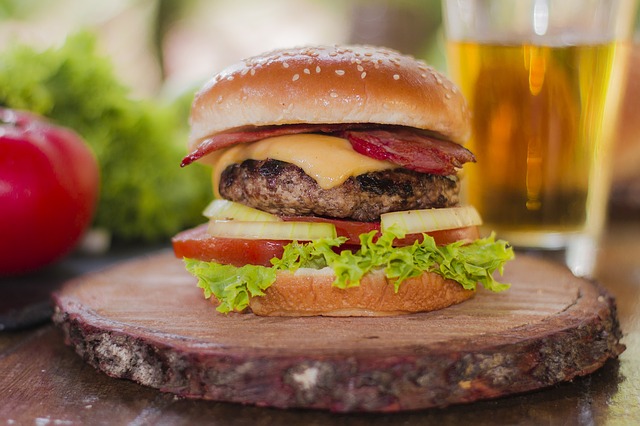 Hamburger on a wooden board.