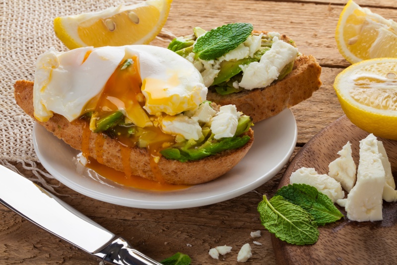 Breakfast plate with bread, egg, and cheese.