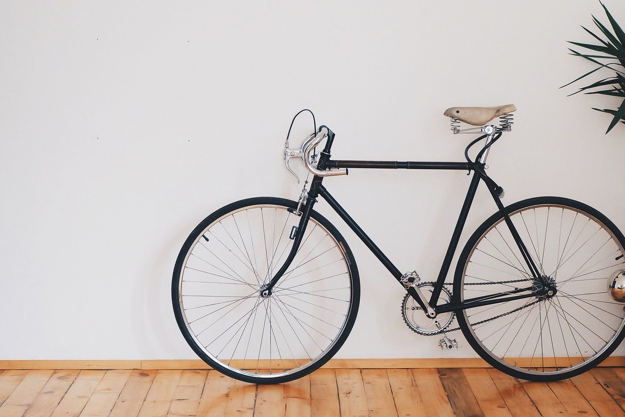 Vintage bicycle against a rustic background.