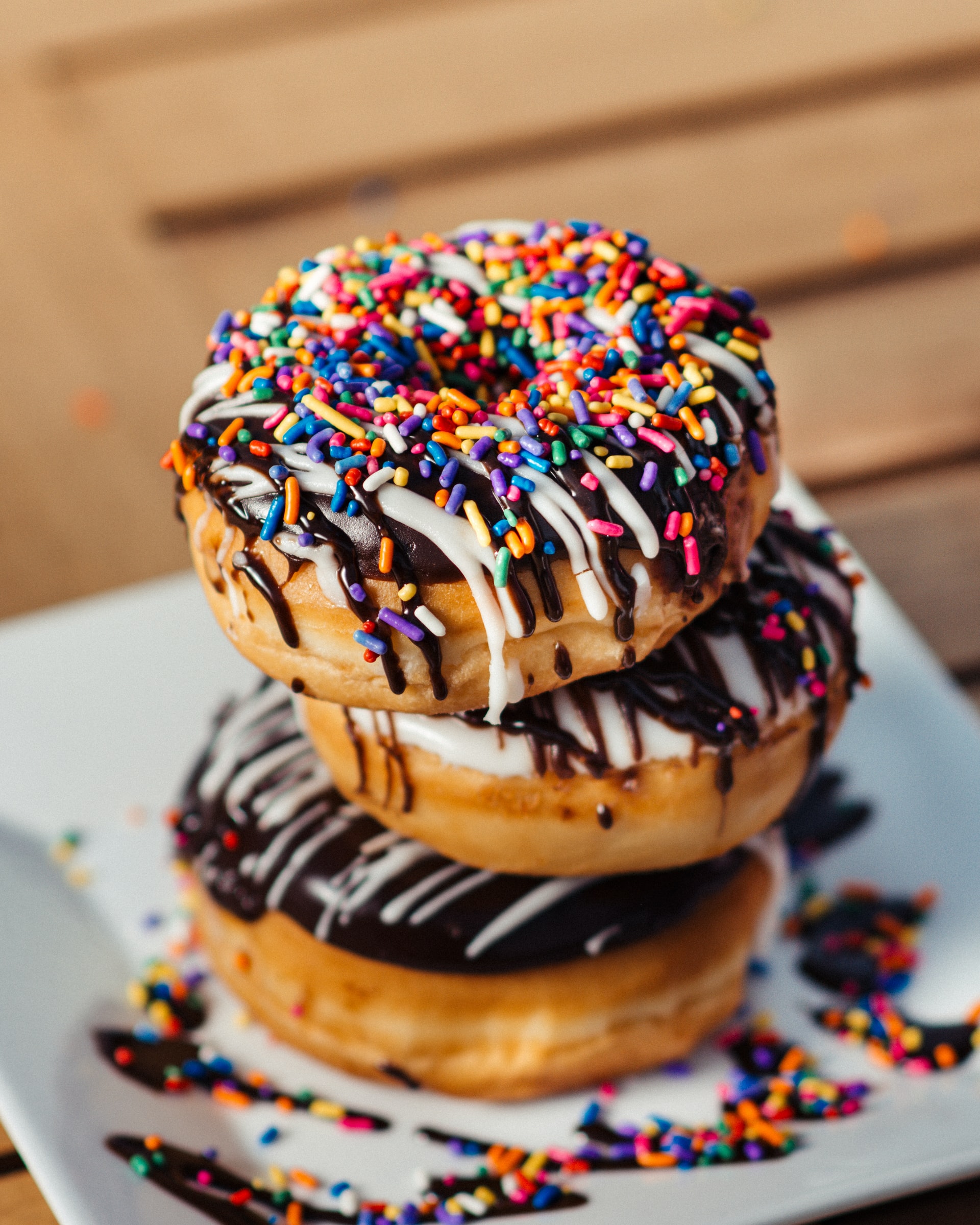 Stacked donuts with toppings.